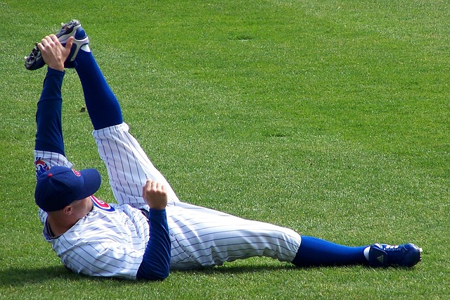 A Chicago Cubs baseball player stretching